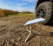 Starlink Mini satellite internet device set up outdoors with clear sky background
